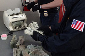Authorities count money seized in an Immigration and Customs Enforcement operation. Department of Homelnad Security agencies, such as ICE, accounted for more than half the $7 billion in seized or forfeited assets the government took in over the past decade.