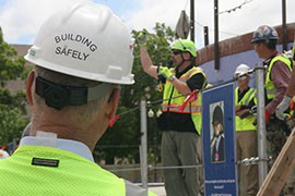 A worker gives a safety demonstration for Clark Construction Group workers during a stand-down at the site of the future National Museum of African American History and Culture in Washington,D.C.