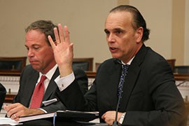 Mike Fernandez, right, speaks at a Capitol Hill briefing by business and farm interests pushing for immigration reform. Fernandez, an executive at Cargill, said there are job openings without people to fill them, and immigration reform would bring in both skilled and unskilled workers.