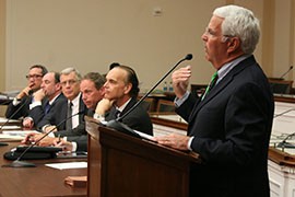 Former Arizona Rep. John Shadegg, right, speaks about the benefits of immigration reform for businesses and agriculture. He said reform could improve border security and prevent the exploitation of immigrants.