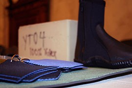 Products made from Yulex Corp.'s alternative rubber include mattress foam, a diving shoe and fabric swatches. They were on display at a congressional event that featured bio-based businesses.