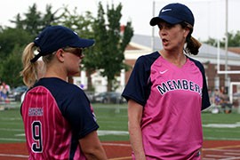 Rep, Kyrsten Sinema, D-Phoenix, left, speaks with Rep. Cheri Bustos, D-Ill., before the charity softball game against presswomen this week to raise funds for breast cancer research.