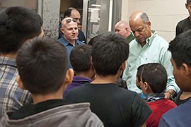 Homeland Security Secretary Jeh Johnson visits a Texas facility this month where unaccompanied immigrant children are being processed after being caught crossing the Southwest border into the U.S.