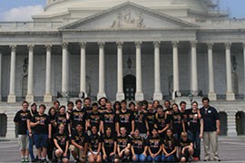 Willow Canyon HIgh School Marching Band members pose for a group picture at the U.S. Capitol, a day before they were set to march in the Fourth of July parade in Washington.