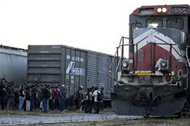 A group of immigrants waits in Arriaga, Chiapas, Mexico. in March to stow away on the northbound freight train known as 
