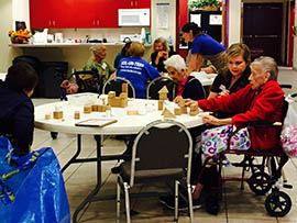 At Oakwood Creative Care day club members get the opportunity to create art using three-dimensional cardboard shapes, hot glue, paper mache and paint.