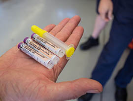 Capt. Robb Anders, a paramedic with the Tempe Fire Department, holds vials of Narcan, the brand name of naloxone. When administered to people who have overdosed on opiates, Narcan triggers immediate withdrawal and can save their lives.