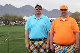 Brothers Sam and Cary Grapentine show off their color coordinated outfits as they enjoy the first day of tournament play at the Waste Management Phoenix Open.
