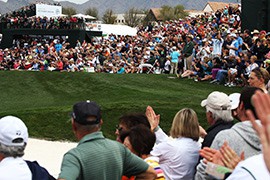 The gallery at the Waste Management Phoenix Open bursts into applause as Phil Mickelson hits his approach shot into the 9th green of the TPC Scottsdale.