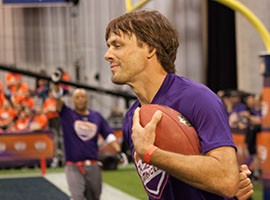 Jake Plummer is pictured scoring a touchdown during the Tazon Latino flag football game Thursday, January 29, 2015 at the Phoenix Convention Center in Downtown Phoenix.