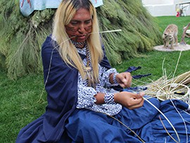 Timothy Ward. Jr, 30, weaves a traditional Apache burden basket at Arizona Indian Festival at Scottsdale Civic Park.