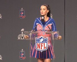 Katy Perry jokes about “deflate-gate” and Marshawn Lynch’s antics at Media Day at a press conference for the Super Bowl XLIX halftime show.