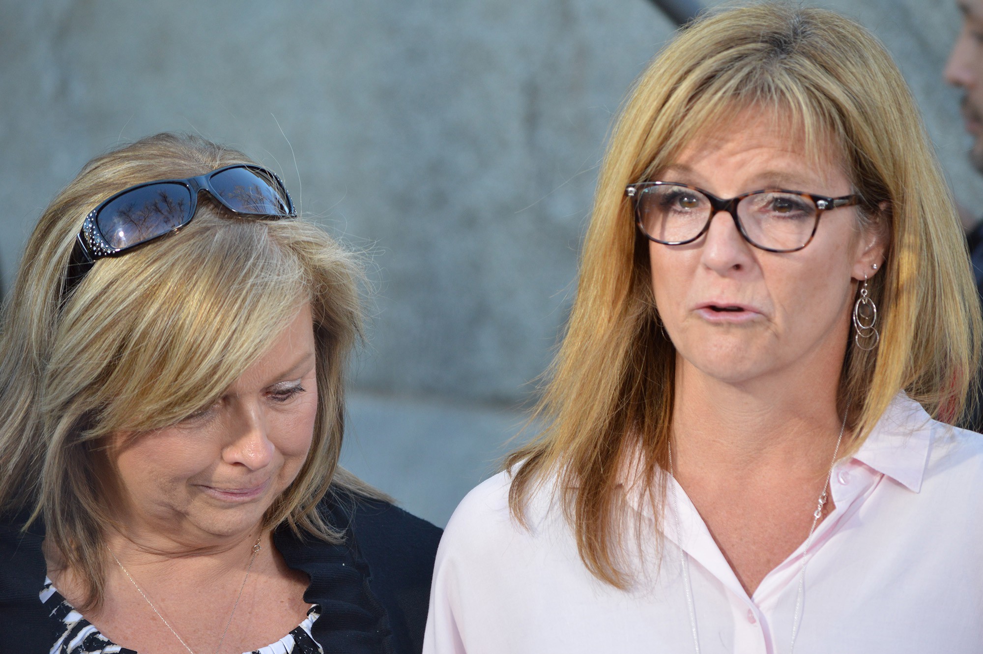 Lori Lyon, right, and Terri Crippes, aunts of Kayla Mueller, share a statement on behalf of the famiy at a news conference Tuesday in Prescott.