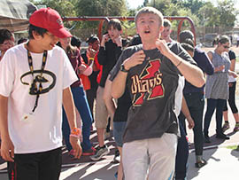 Eric Robinette (center) and Michael Watts (left) participate in D-Backs Day at the Arizona Center for Comprehensive Education and Life Skills in Phoenix.