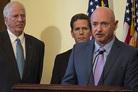 Retired astronaut and Navy Capt. Mark Kelly spoke with his wife, Gabby Giffords, to support stronger background checks on gun purchases.