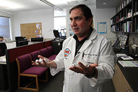 Dr. F. Mazda Shirazi, medical director of the Arizona Poison and Drug Information Center at the University of Arizona, holds vials of antivenom. He says getting medical attention as soon as possible is the correct response to a rattlesnake bite, adding that using a snakebite kit can be more harmful than the bite itself.