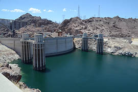 The level of Lake Mead behind Hoover Dam, as shown in this July 2014 photo, has fallen to record low levels. A continued decline would prompt the U.S. Department of the Interior to declare a shortage that would trigger a first stage of cuts in Arizona’s deliveries of Colorado River water through the Central Arizona Project.
