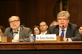 The State Department's Simon Henshaw, right, told a Senate committee that the family reunification plan aims to keep unaccompanied Central American youth from making dangerous treks to the U.S. border.