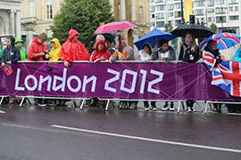 Cycling fans from all over the world line the streets of London, rain or shine, to watch and cheer for womens' road race on Sunday, July 29, 2012.