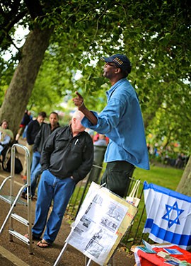 Many speakers at speakers' corner use props to aid in illustrating their content.