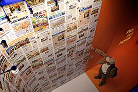 A visitor to Casa Brazil admires a collection of newspapers announcing that Rio de Janeiro would host the 2016 Olympic games.