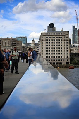 Both locals and tourists gather on the London Bridge to take in the views and enjoy a scenic stroll on Friday, August 3, 2012.