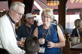 Lisa Lewis, Director of Alumni Relations for the University of Connecticut, greets other UConn supporters at a gathering for alumni at a London pub on August 4, 2012. Many Connecticut supporters traveled to London for this years Olympics, because six of the USA womens basketball players played for UConn.