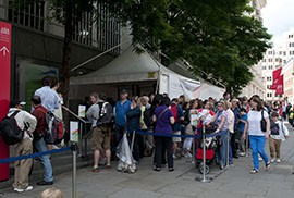A long line waits outside the Olympic Journey: The Story of the Games, a free exhibition at the Royal Opera House in Covent Garden. The exhibit showcases artifacts, images and athletes throughout the history of the Olympic games.